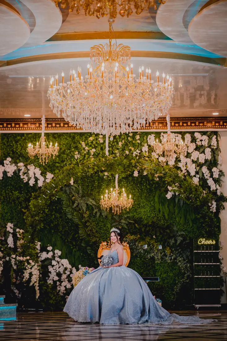 Greenery arch and throne setup at Arelis Celebration Hall quinceañera