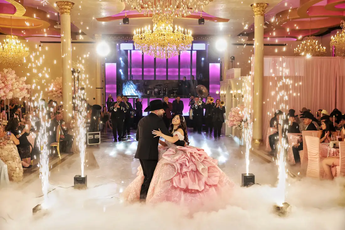 Grand chandelier over the pink ballroom at Arelis Celebration Hall