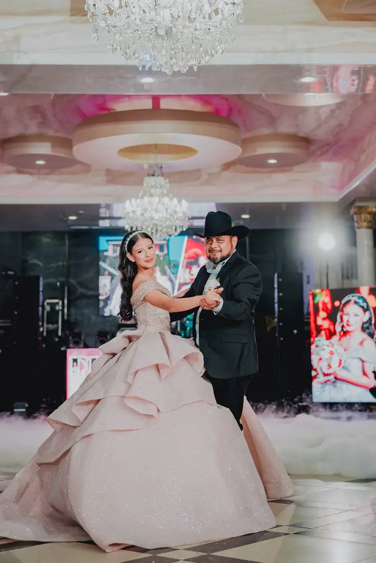 Quinceañera waltz on the ballroom dance floor at The Grand Villa