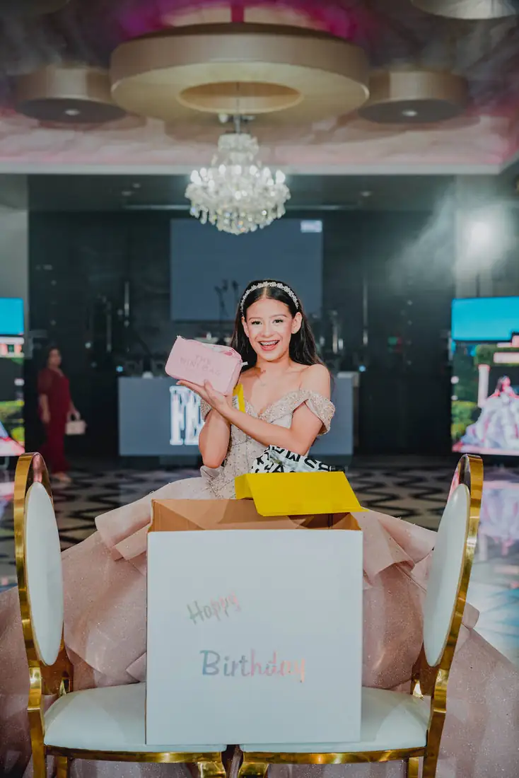 Quinceañera surprise gift moment at The Grand Villa event center