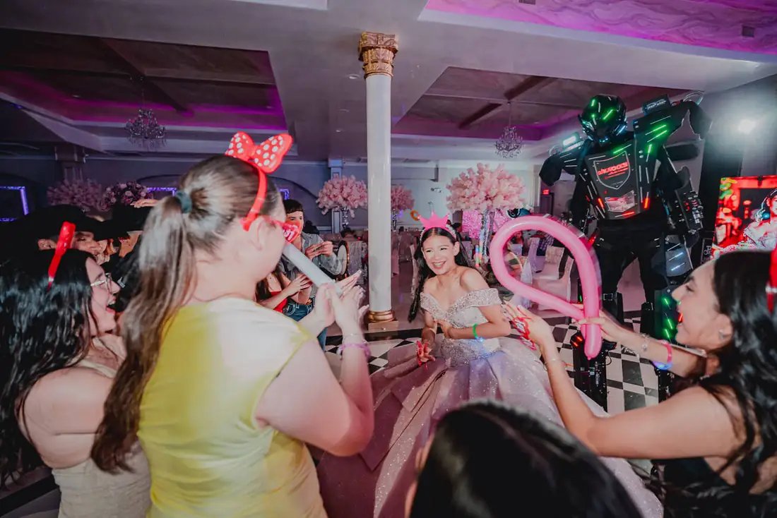 Guests celebrating with balloons at The Grand Villa party hall