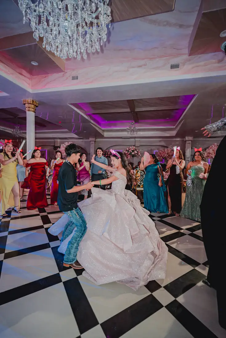 Father-daughter waltz on the black and white dance floor at The Grand Villa