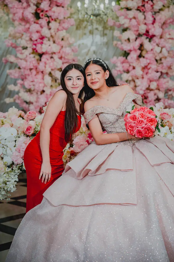 Quinceañera and friend at the cherry blossom flower wall, The Grand Villa