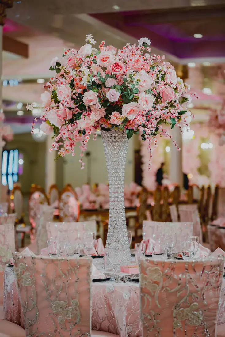 Tall pink floral centerpiece and table styling at The Grand Villa